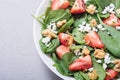 Strawberry salad with spinach cheese and walnut . Healthy food