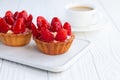 Strawberry shortcake pies strawberries tartlets with custard on white wooden background Royalty Free Stock Photo