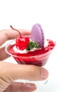 Strawberry shot cake with cherry and macaron Royalty Free Stock Photo