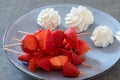 Strawberry skewer with whipped cream