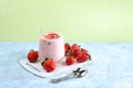 Strawberry smoothie with berries and honey on a bright table.Useful breakfast made with ingredients. Healthy and natural food Royalty Free Stock Photo