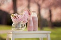 Strawberry smoothie freshly made in a jar, forest spring flowers Royalty Free Stock Photo