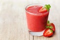 Strawberry smoothie in a glass decorated with mint leaves on rustic background, fresh fruit juice, detox food Royalty Free Stock Photo