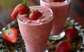 Strawberry smoothie in a glass with fresh strawberries on the table Royalty Free Stock Photo