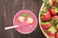 Strawberry smoothie in glass and fresh strawberries on wooden ba Royalty Free Stock Photo