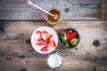 Strawberry smoothie in a glass with honey and yogurt aside Royalty Free Stock Photo