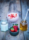 Strawberry smoothie in a glass with ingredients aside Royalty Free Stock Photo