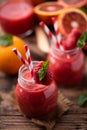 Strawberry smoothie in glass jar, over old wood table Royalty Free Stock Photo