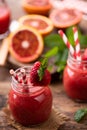 Strawberry smoothie in glass jar, over old wood table Royalty Free Stock Photo