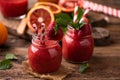 Strawberry smoothie in glass jar, over old wood table Royalty Free Stock Photo