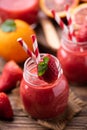 Strawberry smoothie in glass jar, over old wood table Royalty Free Stock Photo