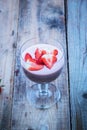 Strawberry smoothie in a glass with strawberry slices on top Royalty Free Stock Photo