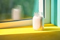 Strawberry smoothie glass on a windowsill near the window. concept healthy eating, freshness, summer