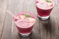 Strawberry smoothie in glass on wooden background Royalty Free Stock Photo