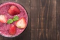 Strawberry smoothie in glass on wooden background, with a lot of Royalty Free Stock Photo