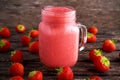 Strawberry smoothie in jar glass on wooden table. healthy food concept for breakfast or snack. Royalty Free Stock Photo