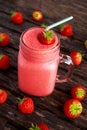 Strawberry smoothie in jar glass on wooden table. healthy food concept for breakfast or snack. Royalty Free Stock Photo