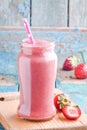 Strawberry smoothie in a jar with a straw Royalty Free Stock Photo