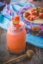 Strawberry smoothie juice , on topping honey tasty for summer on wood table , sweet water juice for health Royalty Free Stock Photo