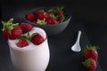 Strawberry smoothie / milkshake glass with fresh strawberries in a bowl Royalty Free Stock Photo