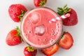 Strawberry smoothie or milkshake in a glass with a straw and fresh berries on white background. top view Royalty Free Stock Photo