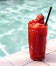 Strawberry smoothie by the swimming pool Royalty Free Stock Photo