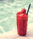 Strawberry smoothie by the swimming pool Royalty Free Stock Photo