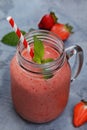 Strawberry smoothies with banana and orange juice in a glass jar Royalty Free Stock Photo