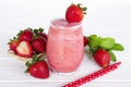 Strawberry smoothies yogurt, juice and strawberry fruit for breakfast in the morning on white wood background.