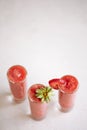 Strawberry smuthie on the white table Royalty Free Stock Photo