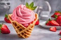 Strawberry sorbet in a waffle cone