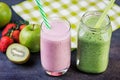 Strawberry and spinash smoothies in glasses with ingredients