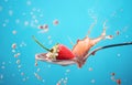 Strawberry splash in milk isolated on blue Royalty Free Stock Photo