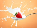 Strawberry splash in milk isolated on yellow Royalty Free Stock Photo