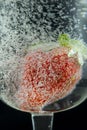 Strawberry splash in sparking water