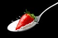 Strawberries with cream in a spoon
