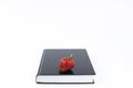 Strawberry. Strawberries on a book. Concept. Holy Bible. On a white background. Book on the table