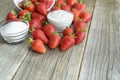 Strawberry sugar and yogurt on a wooden table. Royalty Free Stock Photo