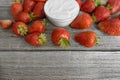 Strawberry sugar and yogurt on a wooden table. Royalty Free Stock Photo