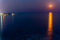 Strawberry supermoon over the mediterranean sea near Antalya, Turkey. Near Duden waterfall