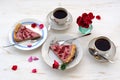 Strawberry tart with black tea,roses and rose petals Royalty Free Stock Photo