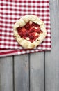 Strawberry tart on checked red and white table cloth Royalty Free Stock Photo