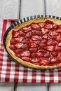 Strawberry tart on checkered red and white table cloth Royalty Free Stock Photo