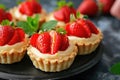 Strawberry tart desserts on dark slate. Gourmet food