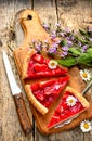 Strawberry tart with jelly on cutting board Royalty Free Stock Photo