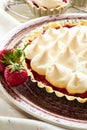 Strawberry tart with meringue on brown plate. Royalty Free Stock Photo