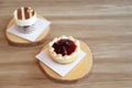 Strawberry tart pie and tiramisu cake on wooden plate Royalty Free Stock Photo