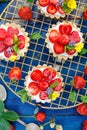 Strawberry tarts, small shortbread tarts with the addition of cream cheese, fresh strawberries and mint on cooling tray Royalty Free Stock Photo