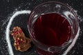 Strawberry tea and tea bag in glass, berry chocolate, on dark background