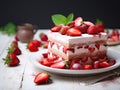 Strawberry tiramisu dessert with mascarpone and whipped cream, Italian cheesecake dessert, pudding or berry trifle cake